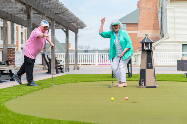 Otterbein Lebanon residents practice putting on green at Terrace Place senior living apartments.