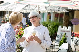 Senior women having ice cream outside at a shop in Granville, OH.