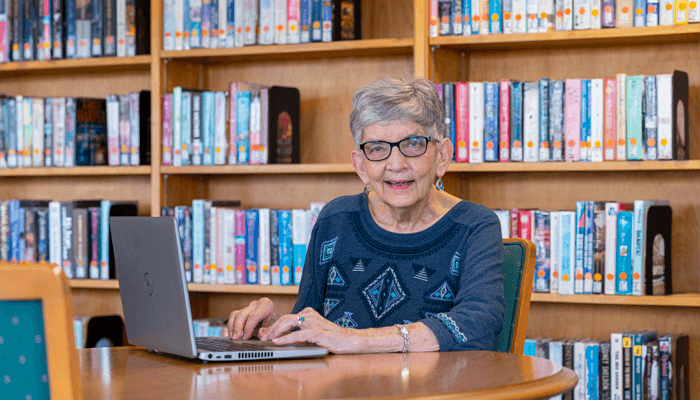 Senior woman taking an online class.