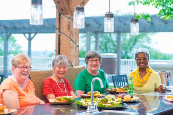 Senior apartment residents dine at outdoor restaurant at Terrace Place at Otterbein Lebanon.