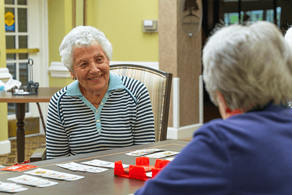 Residents of The Woodlands playing cards.