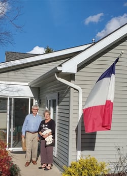 In-text Images Alt Tags Kathie H welcoming guests for Cercle Francophone Patrick and Anne A with the Tri-color flag of France at their cottage at Otterbein Granville Madeleine Cookies Far Breton LEAP group from India Ikebana arrangement