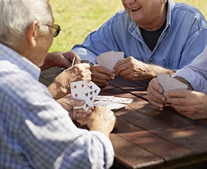 seniors playing a card game