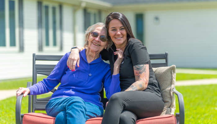 Otterbein Cridersville assisted living resident sitting with one  of her nurses. 
