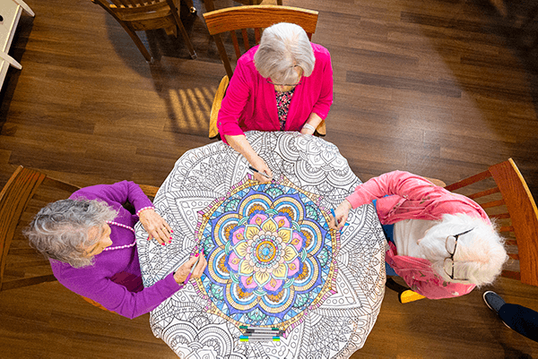 Otterbein SeniorLife Community residents working on a coloring project together.