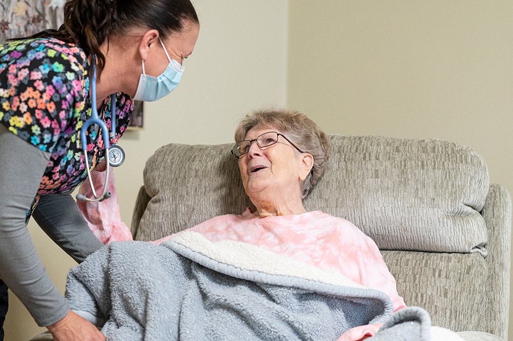A senior woman being cared for by professional services.