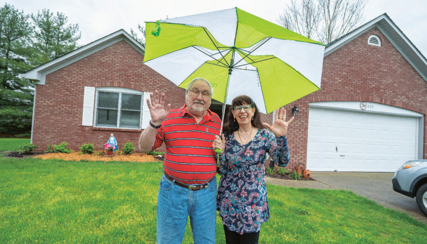 Otterbein Franklin couple standing in front of their cottage home