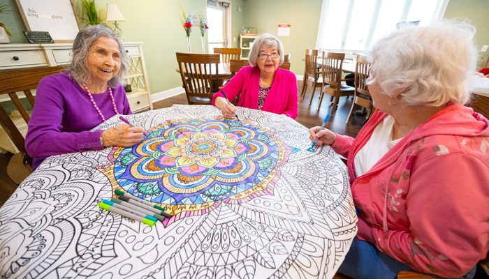 Otterbein Cridersville residents doing a coloring activity together.