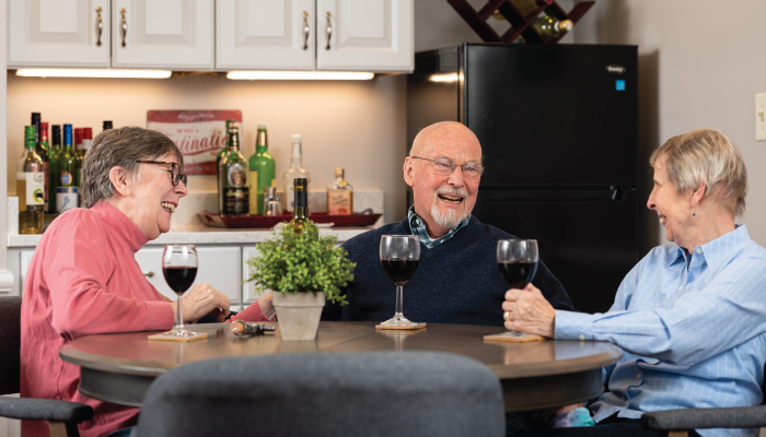 Otterbein Granville residents enjoying a glass of wine and laughing