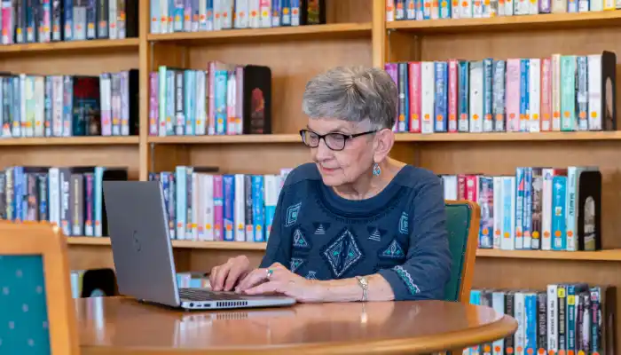 Senior woman using a laptop to work on her taxes
